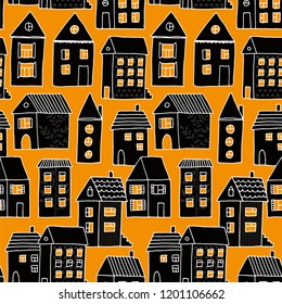 Seamless pattern with houses in black and orange, hand drawn vector halloween background