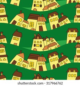seamless pattern of houses on a green background
