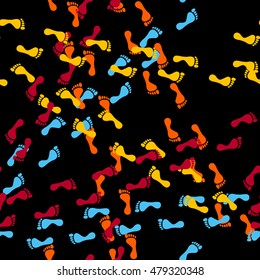 Seamless pattern of human footsteps on the black background. Vector  illustration
