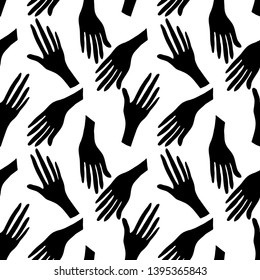 Seamless pattern with human hands. Black silhouette on white background. 