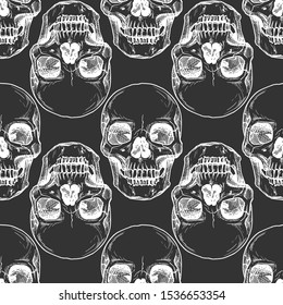 Seamless pattern with human skull. Vector illustration in vintage engraved style.