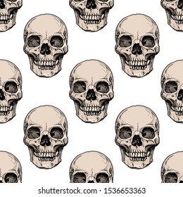 Seamless pattern with human skull. Vector illustration in vintage engraved style.