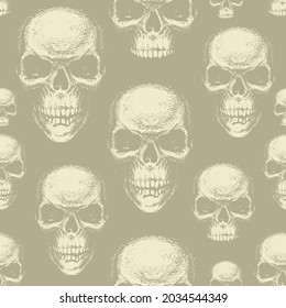 Seamless pattern with human skulls in beige colors. Vector background with hand-drawn skulls. Graphic print for apparel, fabric, wallpaper, wrapping paper, design element for halloween party