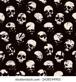 Seamless pattern with human skulls with stains and spatters. Vector background with sinister smiling skulls in grunge style. Graphic print for clothes, fabric, wallpaper, wrapping paper