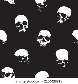 Seamless pattern with human skulls. Vector background with sinister smiling skulls in retro style. Graphic print for clothes, fabric, wallpaper, wrapping paper