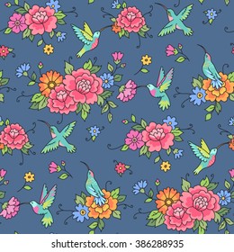 Seamless pattern. Hummingbirds fly among the flowers on blue background
