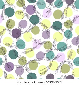Seamless pattern with hummingbirds on a polka dot background