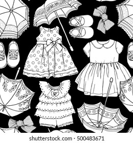 Seamless pattern with image of a dress, umbrella, shoes, bow for girl on a black background. Vector illustration.