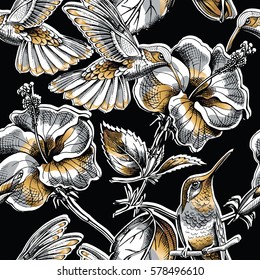 Seamless pattern with image gold Hummingbird and Hibiscus flowers on a black background. Vector illustration.