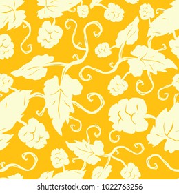 Seamless pattern with the image of hop plant. Illustration in hand drawn style. Light print on yellow background