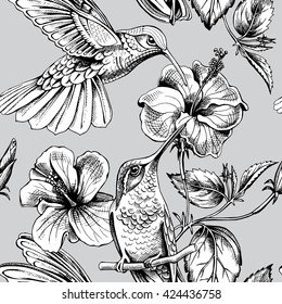 Seamless pattern with image of a Hummingbirds with a Hibiscus flowers. Vector illustration.