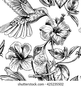 Seamless pattern with image of a Hummingbirds with a Hibiscus flowers. Vector illustration.