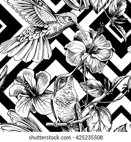 Seamless pattern with image of a Hummingbirds with a Hibiscus flowers. Vector illustration.