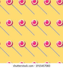 Seamless pattern with the image of lollipops. Colorful caramel candy in vector on yellow background.