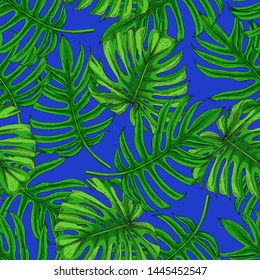 Seamless pattern with the image of palm leaves. Bright green and emerald monster leaves on a blue background.