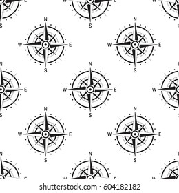 Seamless pattern with the image of vintage compass on white background isolated. The device allows to determine the direction of the world.