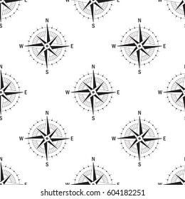 Seamless pattern with the image of a vintage windrose on a white background isolated. The device allows to determine the direction of the cardinal points and prevailing wind direction.