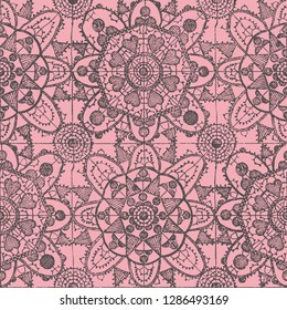 seamless pattern imitating antique lace in dark red on a pink fond