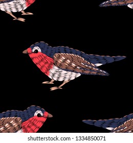 Seamless pattern. Imitation of embroidery. Embroidered birds. Satin stitch. Bird embroidered with stitches. Isolated on black background. Vector illustration.