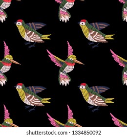 Seamless pattern. Imitation of embroidery. Embroidered with stitches birds. Satin stitch. Isolated on black background. Vintage ornament. Hand drawn. Vector illustration.