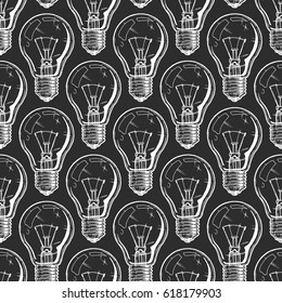 Seamless pattern with incandescent light bulbs. Vector illustration background in ink hand drawn style on black background.  