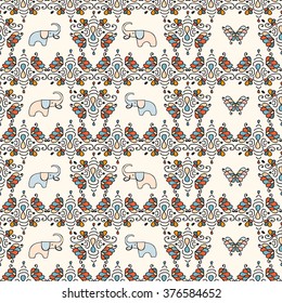 Seamless pattern with indian motif elements with cute elephants and butterflies

