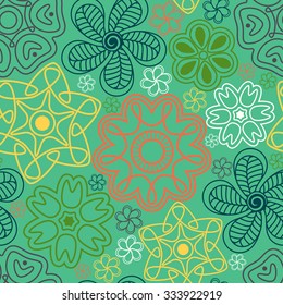 Seamless pattern in Indian style.  Ethnic ornament with flowers and paisleys.