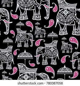 Seamless pattern with indian wedding elephant and paisley patterned on background color.