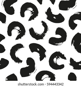 Seamless pattern with ink brushstrokes, black stains on white, background texture with artistic design elements