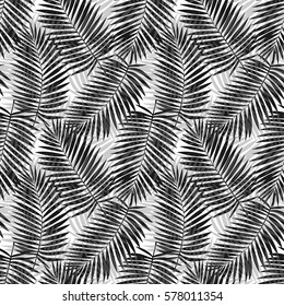 Seamless pattern of intricate palm leaves silhouette on white. Tropical wallpaper, textile print, exotic background.