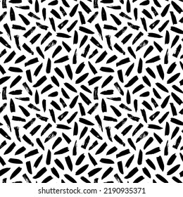 Seamless pattern with irregular black dashes. Simple geometric texture with short brushstrokes. Abstract background in Memphis style. Ink painted hand made texture. Vector black ink ornament.