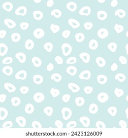 Seamless pattern with irregular uneven polka dots in pastel shades for children is textiles and office decoration