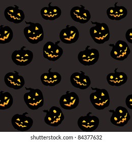 Seamless pattern with jack-o-lanterns on black background.
