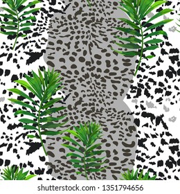 Seamless pattern with jaguar skin and tropical leaves.