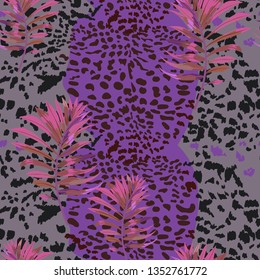 Seamless pattern with jaguar skin and tropical leaves.