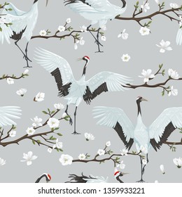 seamless pattern with japanese cranes and blooming magnolia