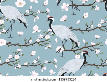 seamless pattern with japanese cranes and blooming magnolia