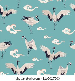 Seamless pattern with Japanese cranes and clouds