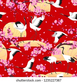 Seamless pattern with Japanese cranes, pink flowering tree branches on red background. Endless texture decoration in oriental style with sakura or plum flowers and birds. Vector flat illustration 