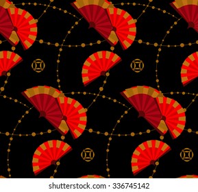 Seamless pattern in the Japanese style with a stylized colored fans and beads on a black background.