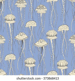 Seamless pattern with jellyfish on a blue background. Hand drawn doodle. Vector illustration
