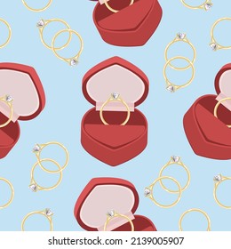 Seamless pattern of jewelry of a gold ring and a case for it on a pale blue background.Vector illustration.The pattern can be used in wedding designs.textiles, postcards.