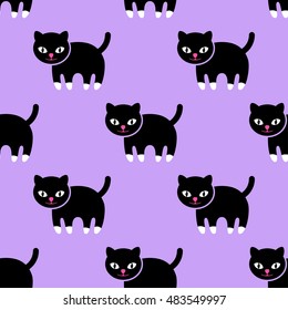 Seamless pattern. Kitten on a purple background.