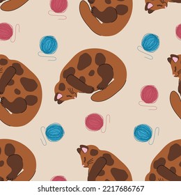Seamless pattern with kittens and balls. Domestic cat with balls of thread. Background design for baby fabric, wallpaper or packaging.