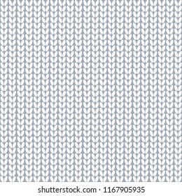 Seamless pattern. Knitted fabric. Wool knitting. White. Vector.