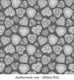 seamless pattern of knitted hearts for valentine's day, vector repeating pattern, hearts scattered on gray background, seamless pattern for printing on fabric or paper