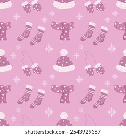 Seamless pattern, knitted pink hats and scarves with snowflake decorations. Christmas pink background, print, textile, vector