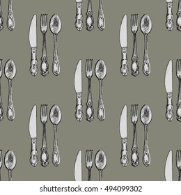 Seamless pattern with knives, forks and spoons . Hand drawn abstract background.