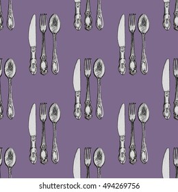 Seamless pattern with knives, forks and spoons . Hand drawn abstract background.