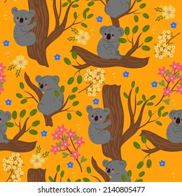 Seamless pattern with koalas on the branches. Vector graphics.